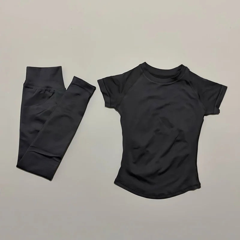 Women's seamless 2-piece workout set — short-sleeve top and high-waist long leggings in Black