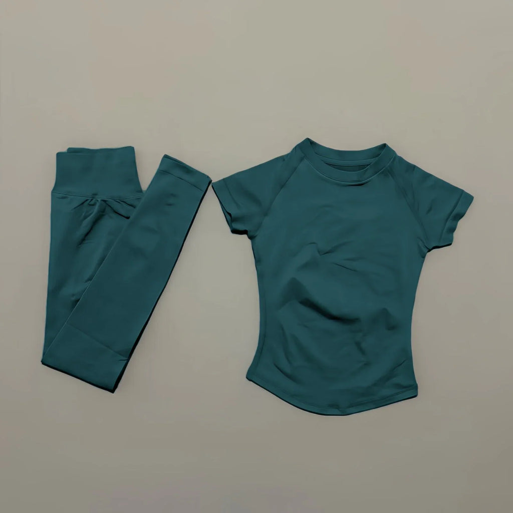 Women's seamless 2-piece workout set — short-sleeve top and high-waist long leggings in Pine Green