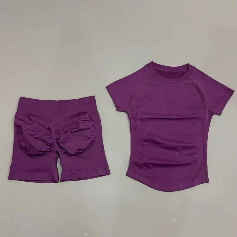 Women's seamless 2-piece workout set — short-sleeve top and high-waist scrunch shorts in Grape Purple